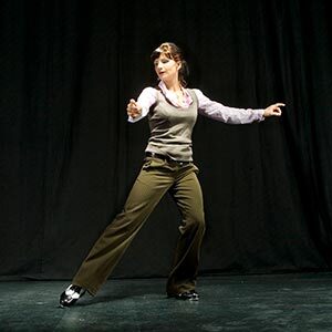 adult tap student working on their tap technique for a performance