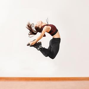 dancer doing a c jump