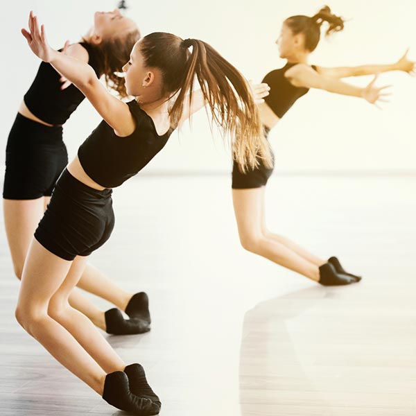 beginner contemporary dancers working on floor work in class at LA Dance Academy