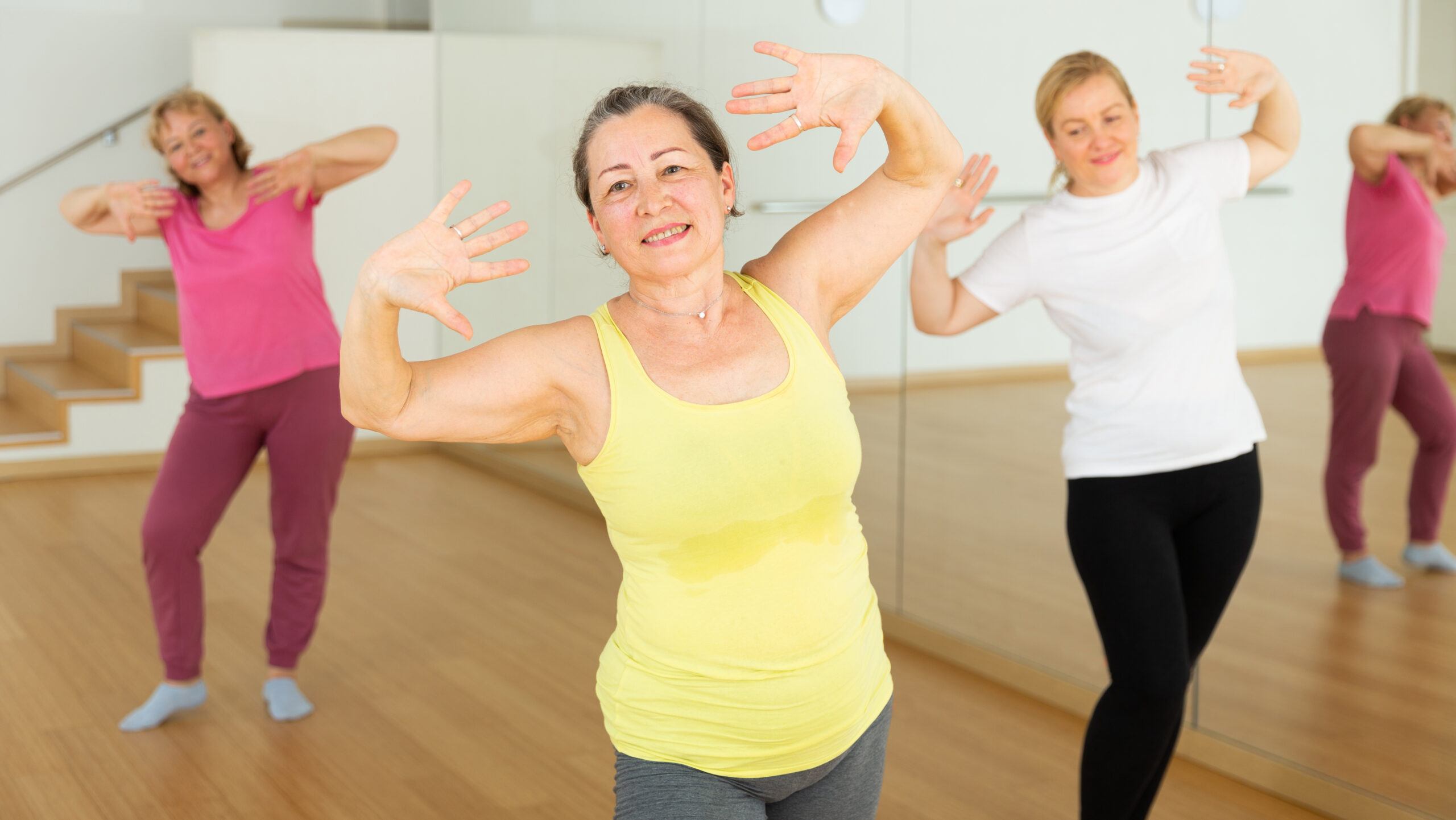 adult dancer having fun in class while getting a good workout