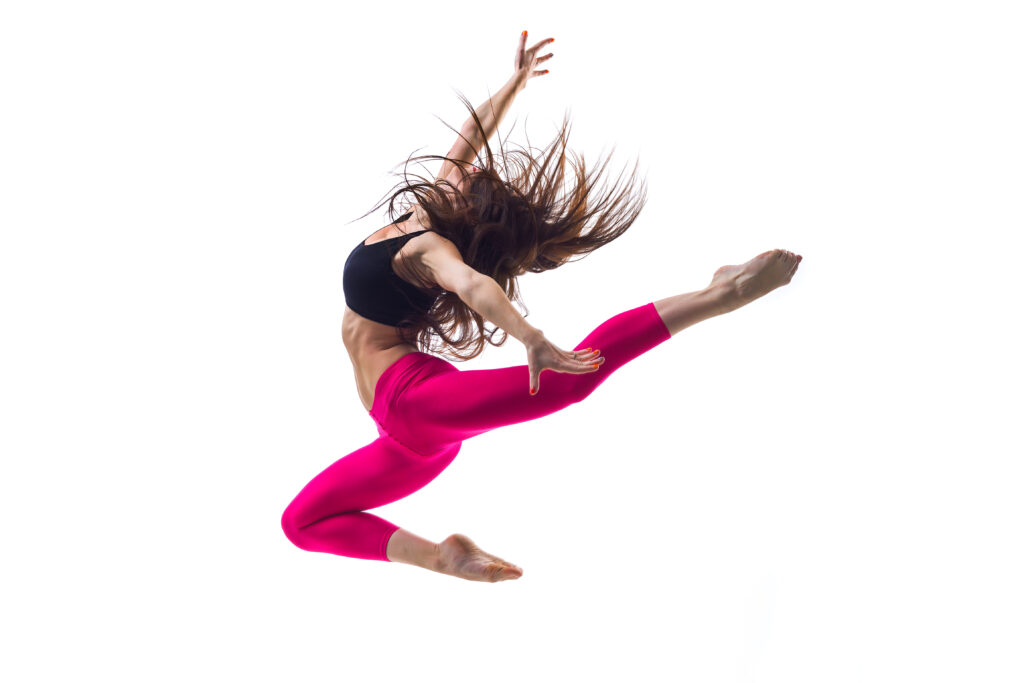 the dancer advanced jazz dancer leaping in class at LA Dance Academy