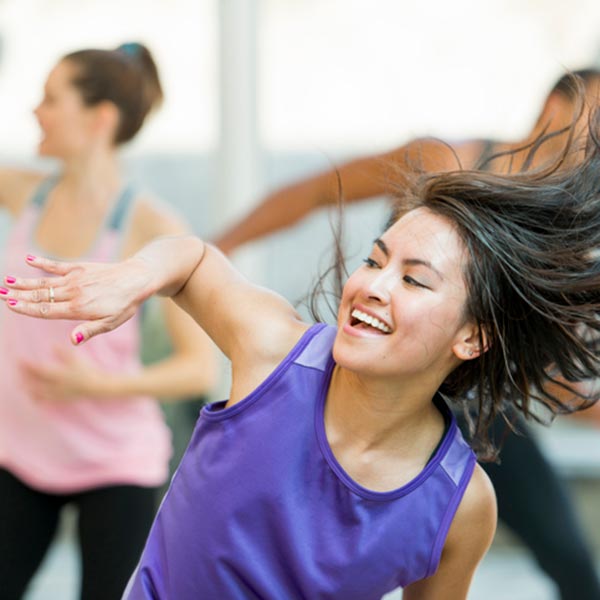 women having fun and while getting fit in dancefit class