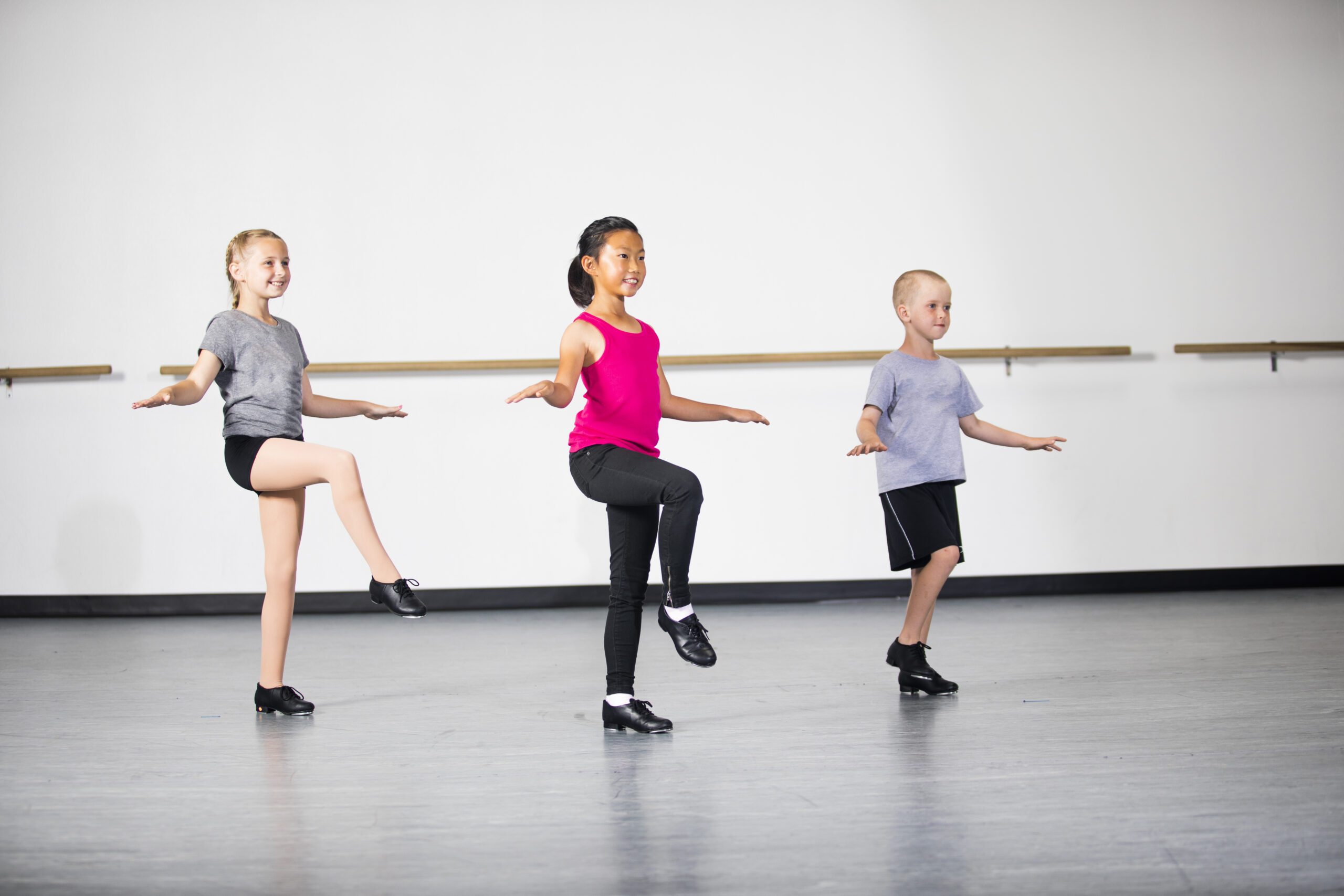 beginner tap students in class working on control and musicality