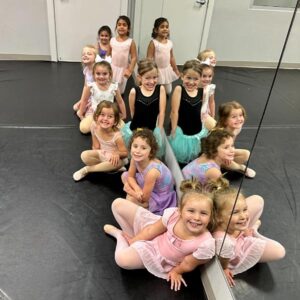 young kids smiling during ballet class at LA Dance Academy
