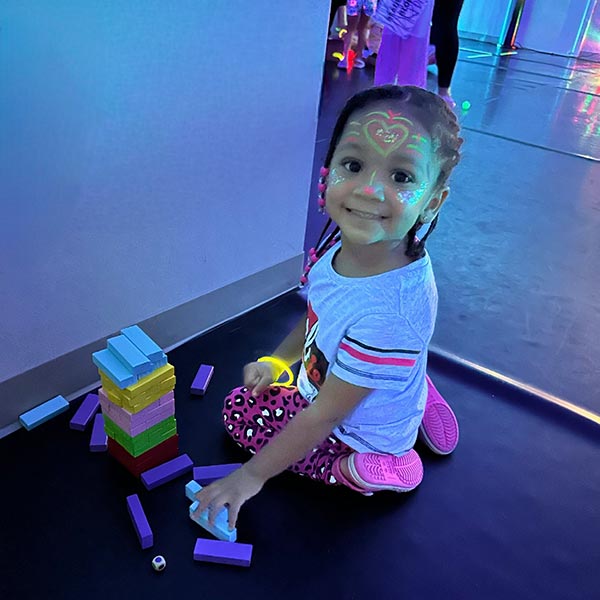 a young girl at a glow in the dark event at LA Dance Academy
