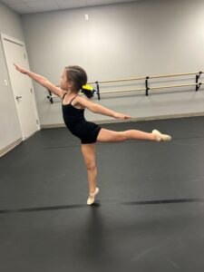 Young ballet dancer at LA Dance Academy working on her arabesque