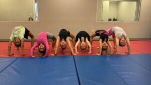 Tumbling II - Backbend Tumbling students working on backbends