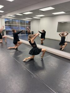 Intro To Contemporary-floorwork dancers in contemporary class working on their recital dance and using proper technique.