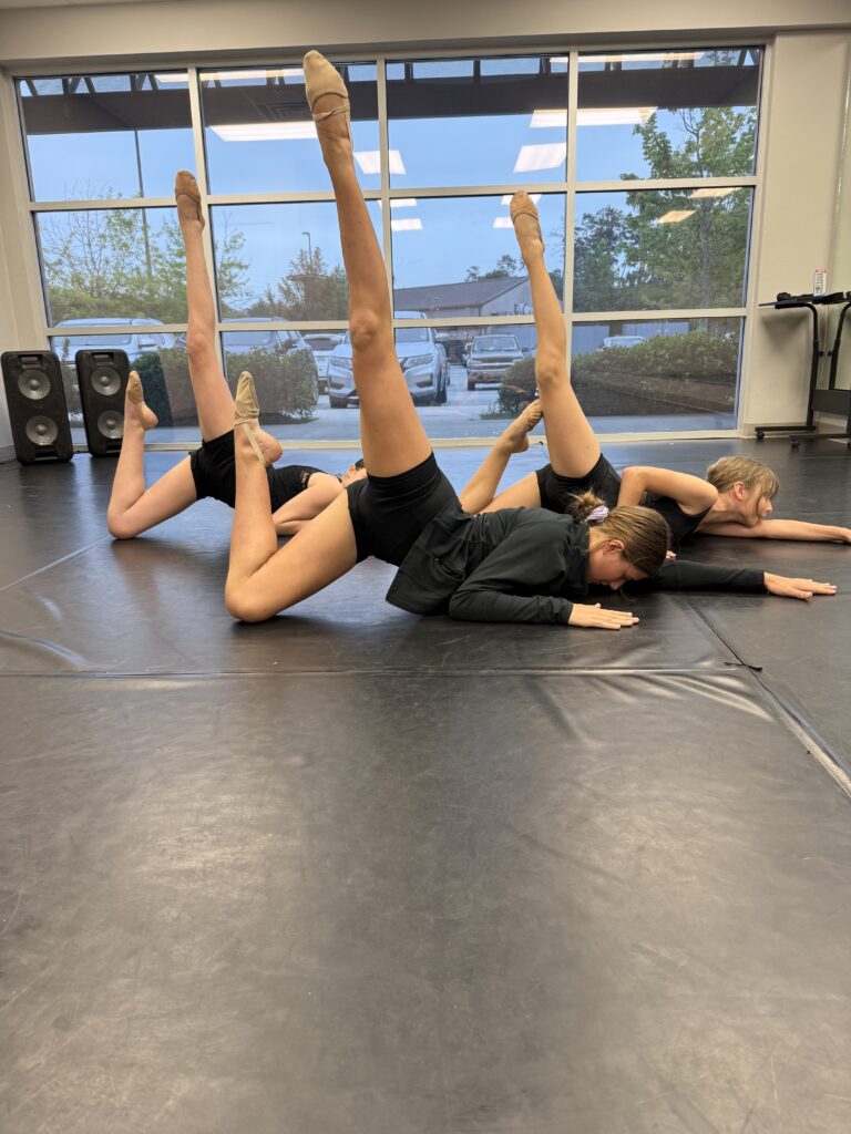 Intro to Contemporary-pose young dancers working on their final pose for the annual recital