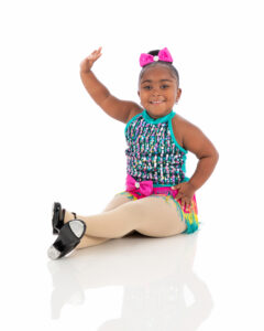 Preschool tap dancer with a smile on her face because she loves tap class and her teachers at LA Dance Academy