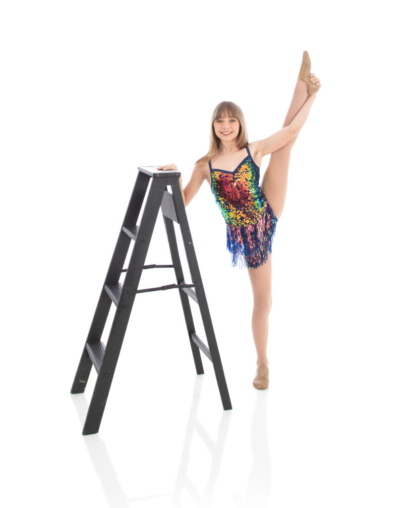 Jazz II - Leg hold Intermediate Jazz dancer is showing of her strength and flexibility in her jazz II dance costume for the annual recital.