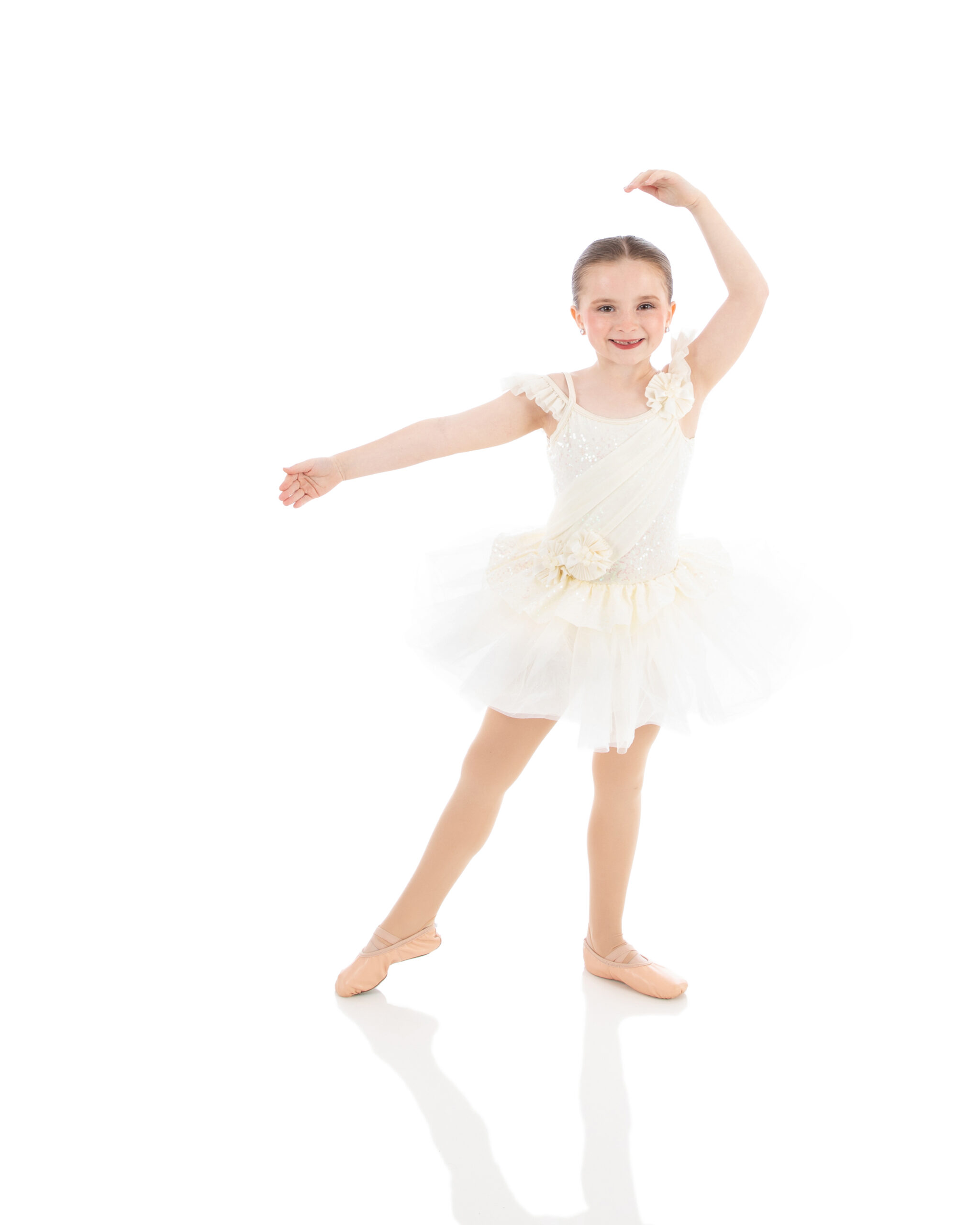 Young ballet student working on her arm placement and positions of the feet.