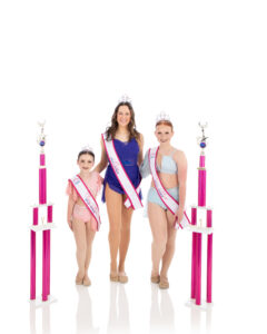 Nyla Title Winners Competition dancers at LA Dance Academy are smiling as they show off their accomplishments.