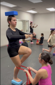 a competition dancer works on her strength, focus and coordination during a conditioning class at LA Dance Academy